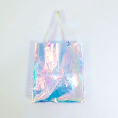 Make Them Jelly Iridiscent Tote Bag By Jelly Jeans Limited Edition An Absolute Gemstone The Color Is Clear Hologram Neon Colorful Shinny Shimmers. Artsy And Rare With A Stunning Iridescence, This Bag Is Ready To Bright Your Summer! Resistant With Your Computer And All Summer Items. Plastic 100% Summer Bag Tote Revolve Style 90s Style! New And Never Worn. #Makethemjelly Trendy Iridescent Bags, Trendy Iridescent Party Bag, Iridescent Rectangular Bag For Gift, Iridescent Trendy Bag For Everyday Use, Trendy Iridescent Bag For Everyday Use, Trendy Iridescent Bags For Everyday Use, Iridescent Rectangular Shoulder Bag For Party, Iridescent Rectangular Shopping Bag, Straw Beach Tote