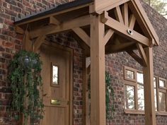 a wooden porch attached to a brick building