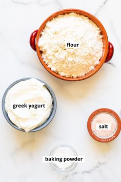 ingredients to make greek yogurt in bowls on a marble counter top with text overlay