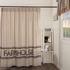 a shower curtain with the word farmhouse on it