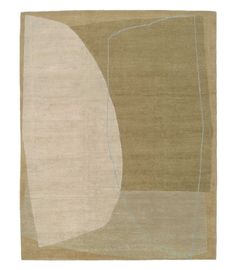 a beige rug with an abstract design on it