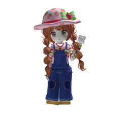 a small doll with long hair wearing overalls and a pink hat is standing in front of a white background