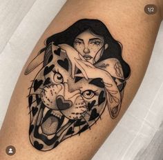 a woman and a tiger tattoo on the right thigh, with hearts in her hair