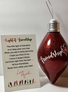 a christmas ornament with a card attached to it