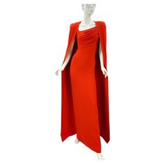 Tom Ford Venetian Red Silk-Georgette Evening Cape Dress Italian size - 38 F/W 2023 Collection TOM FORD's Fall '23 collection was the founder's swan song before stepping down, highlighting some of his hero designs from the past 13 years. A redux of a style from 2012, this beautiful cape is cut from silk-georgette in a clean, flowing silhouette. This gown is based on the style Gwyneth Paltrow wore to the 2012 Oscars. Cut from silk-georgette, it has a draped asymmetric neckline and figure-skimming fit that reaches the floor. Designed for a slim fit, Internal shoulder pads, Mid-weight, Stretchy fabric, Zip fastening at back. Measurements: Length - 62 inches, Bust - 30/32", Waist - 25", Hips - 32/34". Made in Italy. New with tag. Red Formal Dress With Cape Sleeves, Red Cape Sleeve Dress For Evening, Tom Ford Dress, Dress Italian, Cape Fashion, Italian Dress, Swan Song, Designer Evening Dresses, Royal Outfits