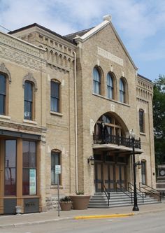 an old brick building on the corner of a street