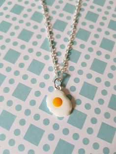 "wear this fried egg necklace sunny side up! made using an enamel pendant hung from silver plated chain.  total length of chain measures approx. 16\" and fastens with a lobster clasp fastener.  egg measures approx. 19mm x 14mm.  * matching earrings also available in our shop! *" Egg Necklace, Food Kawaii, Eggs Breakfast, Crow Skull, Ice Cream Floats, Fried Eggs, Bird Skull, Food Jewelry, Egg Carton