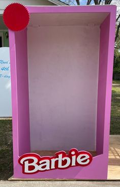 a pink box with the word barbie painted on it