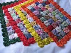 crocheted placemats are arranged on top of each other