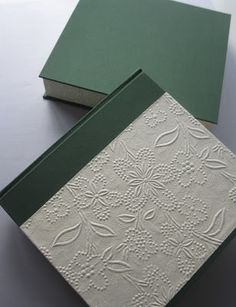 two green and white cards sitting on top of each other