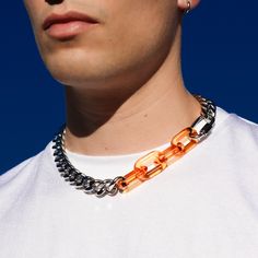 A robust stainless steel curb chain attached to quick link hardware and clear orange acrylic links. This necklace comes in two sizes and is finished with a fitted lobster clasp closure. materials: stainless steel, acrylic measurement: available in 18 inches and 20 inches Rave Aesthetic, 90s Necklace, Street Grunge, Streetwear Jewelry, Edgy Aesthetic, Industrial Hardware, Inspired Necklace, Necklace Chunky, Punk Grunge