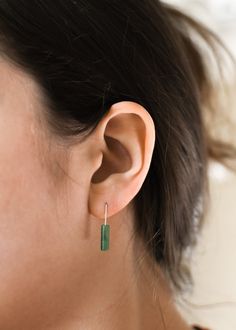 𝗘𝗮𝘀𝘆 𝗧𝗼 𝗦𝘁𝘆𝗹𝗲, 𝗠𝗮𝗱𝗲 𝗧𝗼 𝗟𝗮𝘀𝘁 Our dainty earrings are easy to pair and ready to be worn on repeat! Created to last a lifetime, these earrings will remain evergreen even as the years and trends come and go. 𝗠𝗮𝘁𝗲𝗿𝗶𝗮𝗹𝘀 𝗪𝗲 𝗨𝘀𝗲 These drop earrings are made entirely with sturdy 14k yellow gold filled pieces. They are safe to wear in the shower, but we recommend avoiding prolonged exposure to chemicals like chlorine to keep your earrings like new! These earrings are mad Green Earrings For Everyday, Minimalist May Birthstone Earrings, Classic Green Everyday Jewelry, Green Pierced Everyday Earrings, Green Pierced Earrings For Everyday, Everyday Green Lever Back Earrings, Green Minimalist Sterling Silver Earrings, Minimalist Green Sterling Silver Earrings, Minimalist Single Green Earring