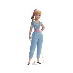 the doll is wearing blue overalls and holding a pink hairbrush in her hand