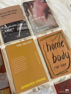 there are many different books on the bed