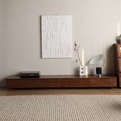 a living room scene with focus on the coffee table and vases sitting on it