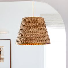 a lamp hanging from the ceiling in a living room