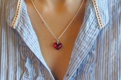 Full of Sparkles, Heart Shaped Red Cubic Zirconia suspended on Sterling Silver 18" length chain. Only one piece made for that special someone! Wrapped in Belesas Branded Box ready for gift giving.(n201)The lovely heart measure 15mm x 12mm*LIKE* us on Facebook http://www.facebook.com/Belesas to find special coupon codes,*FOLLOW* us on Twitter https://twitter.com/#!/Belesas to get more exclusive coupon codes*All item are ready to ship! Free shipping on orders over $150 using coupon code BELESAS150 Red Heart Charm Necklace For Wedding, Red Heart Cut Necklace For Mother's Day, Red Heart Cut Necklace For Wedding, Red Heart Necklace With Birthstone For Gift, Red Heart Necklace With Birthstone As Gift, Red Heart Pendant Necklace For Wedding, Red Heart Birthstone Necklace Gift, Red Crystal Necklace For Valentine's Day, Red Birthstone Heart Necklace For Gift