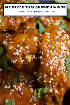 chicken wings with sesame seeds and cilantro on top