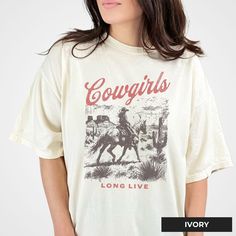 🌟 𝗟𝗼𝗻𝗴 𝗟𝗶𝘃𝗲 𝗖𝗼𝘄𝗴𝗶𝗿𝗹𝘀 𝗧-𝗦𝗵𝗶𝗿𝘁 🌟 Celebrate the enduring spirit of the cowgirl with our Long Live Cowgirls T-Shirt. This Comfort Colors 1717 t-shirt offers comfort and a nostalgic aesthetic, perfect for horse girls and cowgirl enthusiasts. 𝗦𝗵𝗶𝗿𝘁 𝗛𝗶𝗴𝗵𝗹𝗶𝗴𝗵𝘁𝘀: - 𝗦𝘂𝗽𝗿𝗲𝗺𝗲 𝗖𝗼𝗺𝗳𝗼𝗿𝘁: Made from 100% ringspun cotton, ensuring softness and durability for everyday wear. 🌟 - 𝗡𝗼𝘀𝘁𝗮𝗹𝗴𝗶𝗰 𝗗𝗲𝘀𝗶𝗴𝗻: Features a classic "Long Live Cowgirls" graphic, evoking the timeless appeal of cowgirl culture. 🐴 - 𝗘𝘅𝗽𝗿𝗲𝘀𝘀𝗶𝘃𝗲 𝗖𝗼𝗹𝗼𝗿𝘀: Available in various shades to suit any style preference, enhancing the vintage look. 🎨 - 𝗘𝗮𝘀𝘆 𝗠𝗮𝗶𝗻𝘁𝗲𝗻𝗮𝗻𝗰𝗲: Simple care instructions--wash with similar colors and tumble dry on low. 👕 𝗪𝗵𝘆 𝗧𝗵𝗶 Retro Country Aesthetic, Cowgirl Top, Nostalgic Aesthetic, Rodeo Events, Country Aesthetic, Nostalgic Design, Retro Country, Western Outfit, Vintage Cowgirl