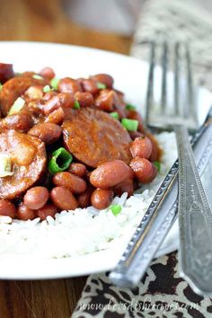 a white plate topped with beans and rice