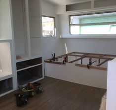 the inside of a house being built with wood flooring