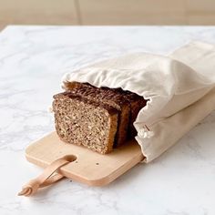 a loaf of bread sitting on top of a cutting board