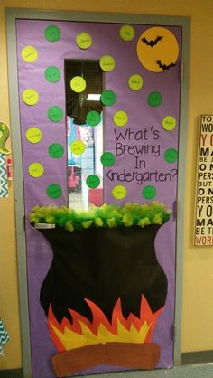 a door decorated to look like a pot full of plants with the words what's brewing in kindergarten written on it