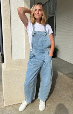 Get ready to rock your style with our Wonderwall Barrel Overalls! Made from comfortable medium wash denim, these overalls feature a unique barrel leg design and self knot tie straps. Perfect for any casual or edgy look, these overalls will have you standing out in all the right ways. Walk with confidence and make a statement in these one-of-a-kind overalls! Denim overalls Barrel leg Knit tie straps Button sides Hannah is wearing a small Overalls Denim, Brunch Dress, Knot Tie, Knit Tie, Floral Jumpsuit, Leg Design, Edgy Look, Dressy Tops, Denim Overalls