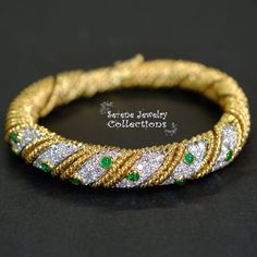 Pretty sparkly diamond weaved 18k yellow gold bracelet with mesmerizing emerald accents! The bracelet opens and closes with a latched clasp. Total Weight: 50 grams Bracelet length: 6.5 inches Precious Metal: 18k yellow gold Precious stones: -Emerald Cabochons: 1.5mm to 2.8mm, 0.8 carats -White Round Diamonds: 3 carats Star Sapphire Ring, 14k Yellow Gold Necklace, Yellow Gold Bangle, Platinum Diamond Rings, 14k Gold Necklace, 18k Yellow Gold Ring, Gold Bangle Bracelet, Gold Bangle, Bracelet Vintage