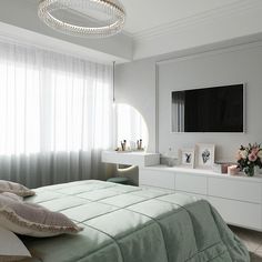 a bedroom with a bed, dresser and television on the wall