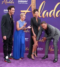 the cast of disney's alada poses for a photo on the purple carpet