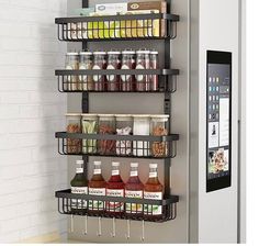 a refrigerator that is next to a shelf filled with drinks and condiments on it