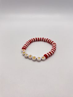 Handmade 7.5 in. preppy beaded bracelet. Contains white, and red 6mm beads, also has gold letter beads . I can custom create a bracelet for you. Just let me know what colors you want, and if you want a word on your bracelet. I can also make phone charms and rings. Holiday Jewelry With Letter Round Beads, Holiday Jewelry With Letter Beads, Holiday Jewelry With Round Letter Beads, Personalized Red Beaded Bracelets For Birthday, Playful Red Stretch Bracelet For Gift, Cute Red Personalized Friendship Bracelets, Cute Personalized Red Friendship Bracelets, Red Beaded Bracelet With Letter Beads For Holidays, Red Friendship Bracelets With Round Beads