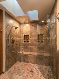 a walk in shower sitting under a skylight