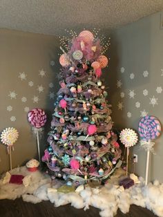 a christmas tree decorated with lollipops and candy