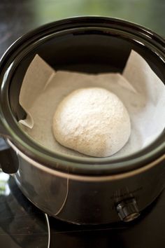 a ball of bread sitting in an air fryer