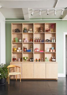 an empty room with shelves filled with various items