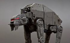 a star wars action figure made out of legos is shown in front of a gray background