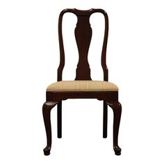 a wooden chair with a beige seat and back cushion on it's side, against a white background