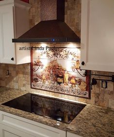 a stove top oven sitting inside of a kitchen next to white cabinets and counter tops