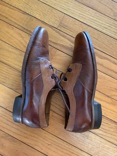 "1970's Florsheim Shoes Lace up front Two tone brown and light brown  Leather sole ,Hard rubber heel Rounded toe with enforced stitching thru out  Great vintage condition lots of life in them ! Size 6 1/2 D Instep -10\" Ball of foot - 4 1/4\"  Heel height -1\" Excellent vintage condition" Hippie Shoes Men, 70s Mens Shoes, Brown Oxfords With Almond Toe And Rubber Heel Cap, Brown Almond Toe Oxfords With Rubber Heel Cap, Brown Closed Toe Dress Shoes For Derby, Retro Brown Wingtip Leather Shoes, Retro Brown Oxfords With Rubber Sole, Vintage Leather Cap Toe Oxfords, Vintage Leather Oxfords With Leather Footbed