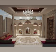 the interior of a lavishly decorated room with chandelier and red couches