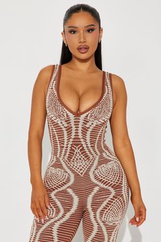 a woman wearing a brown and white patterned bodysuit