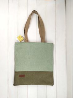 Simple but so outstanding. A great tote soft and functional for all genders. With a magnetic snap closure and a pocket inside. The back of the bag is plain green canvas ► Link for the matching wallet should you have to purchase this beautiful set: https://www.etsy.com/listing/1232246346/green-and-teal-multi-checks-medium?click_key=8ac56c98bad61729d88e35e57fffc407c0fb108c%3A1232246346&click_sum=3779892b&ref=shop_home_active_1 ► MATERIALS Green cotton canvas with a wax effect finish Woven multi ch Affordable Green Rectangular Canvas Bag, Cheap Green Bags With Canvas Lining, Tapestry Fabric, Stationery Accessories, Backpack Tote Bag, Tote Backpack, Green Bag, Green Cotton, Bag Tags