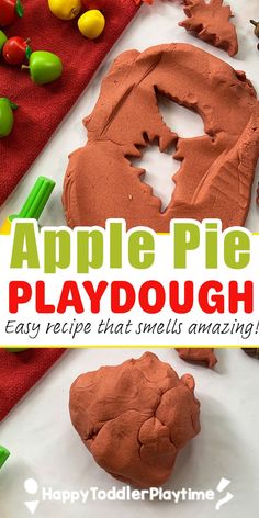 an apple pie playdough is made with clay and apples on the table next to it