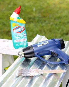 a paintbrush and glue sitting on top of a table