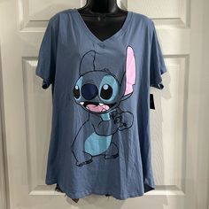 2x Disney V Neck Short Sleeve Tshirt. Blue. 52% Cotton And 48% Polyester. Length Is 28 Inches And Bust Is 48 Inches. Some Of The Stitching On The Vneck Look Like It’s Coming Loose. Cute Blue T-shirt For Loungewear, Loungewear T-shirt With Character Print, Short Sleeve, Loungewear Short Sleeve T-shirt With Character Print, Short Sleeve T-shirt With Character Print For Loungewear, Relaxed Fit Tops With Character Print For Loungewear, Disney Crew Neck Top With Relaxed Fit, Blue Cute T-shirt For Loungewear, Casual Character Print T-shirt For Loungewear, Blue Cartoon Print Tops Relaxed Fit