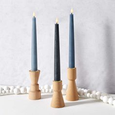 three candles are placed next to each other