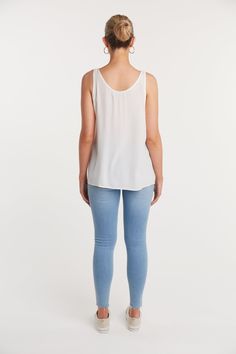 We love our basics! They are our wardrobe staples and are the go to fashion reliable faves. This Basic Tank is the perfect addition, as you can layer it with any outfit or wear it under a cardigan or sweater. This Basic Tank can also be worn on its own as the weather gets warmer. Versatile White Everyday Top, Versatile White Top For Everyday, Versatile White Tops For Everyday Wear, Versatile Stretch Blouse For Layering, Versatile White Blouse For Layering, Casual Tank Top For Spring Workwear, Chic Viscose Tops For Layering, Effortless White Tops For Layering, Versatile White Tank Top For Layering