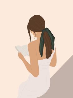 a woman in a white dress reading a book